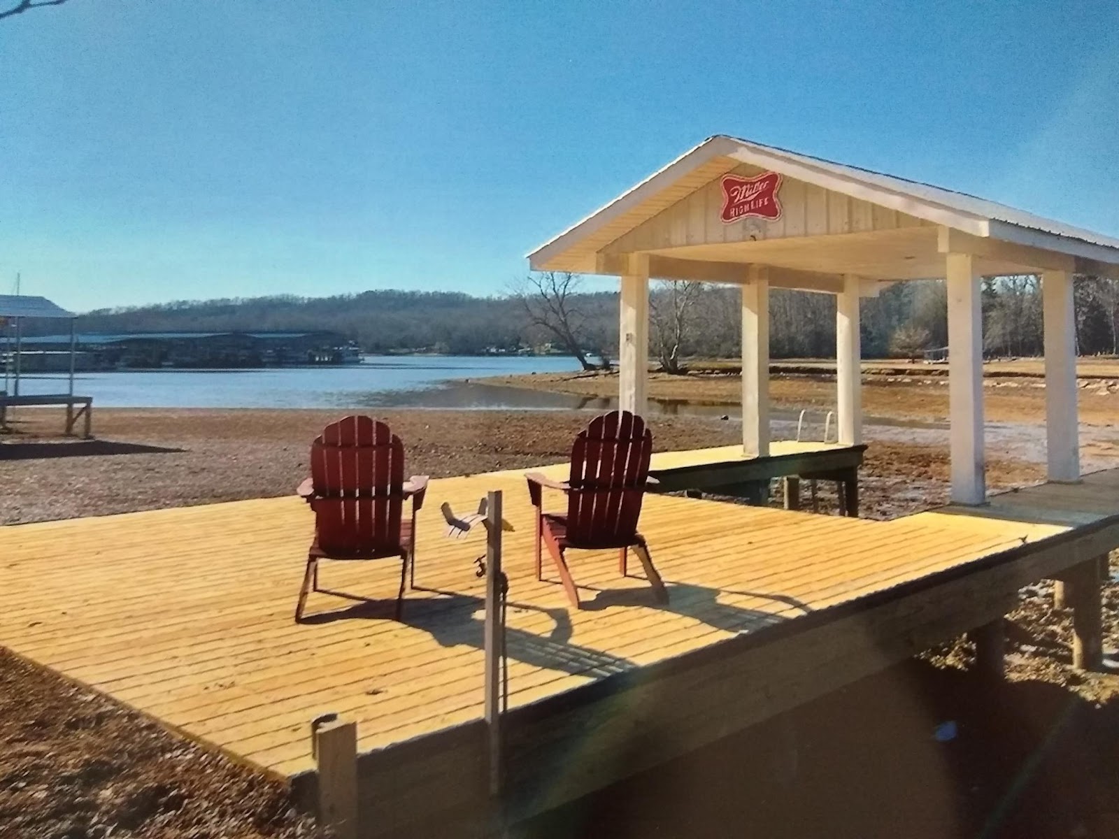 Lakeside dock and deck with covered shelter