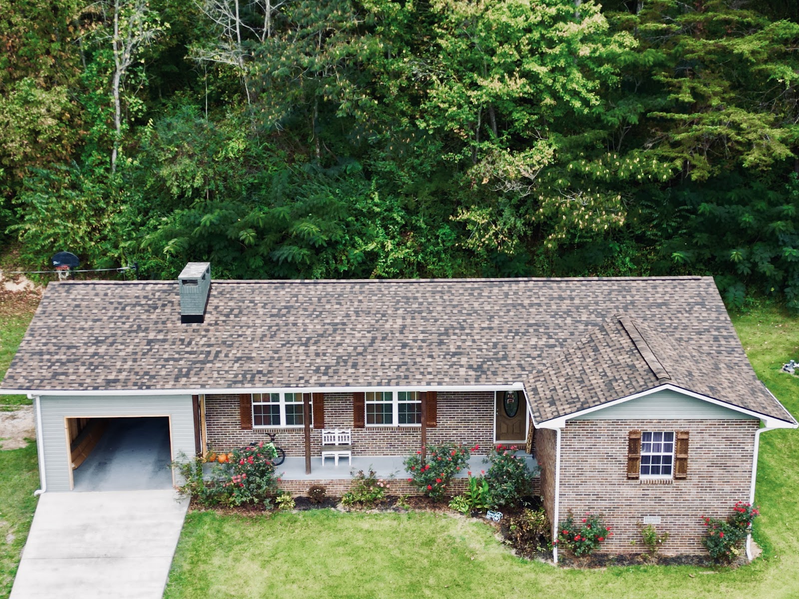Aerial of a brick ranch with new roof