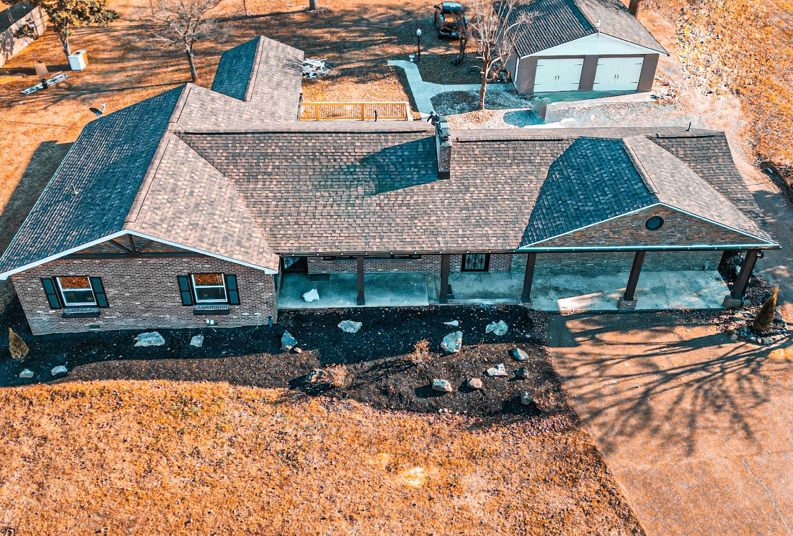 Ranch home with new roof and covered porch under construction