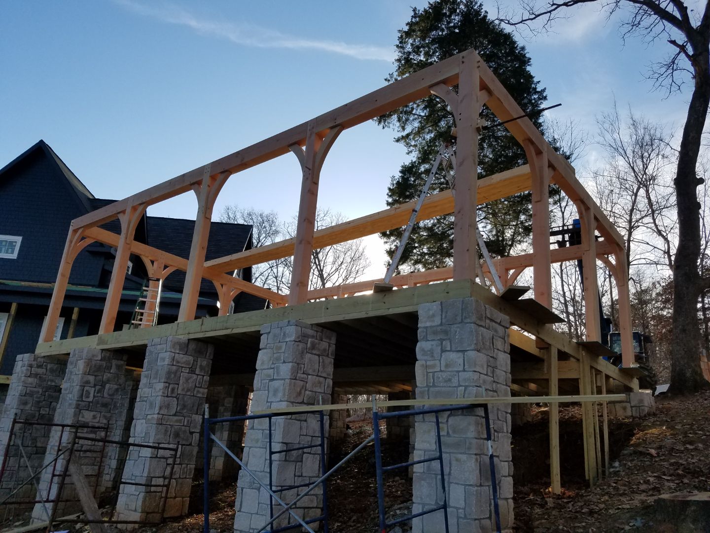 Timber-frame pavilion on stone piers